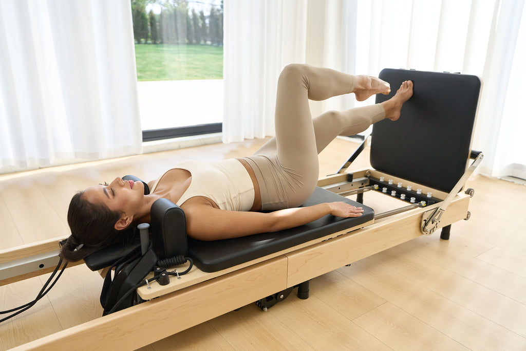 SpaceSaver™ Folding Maple Pilates Reformer