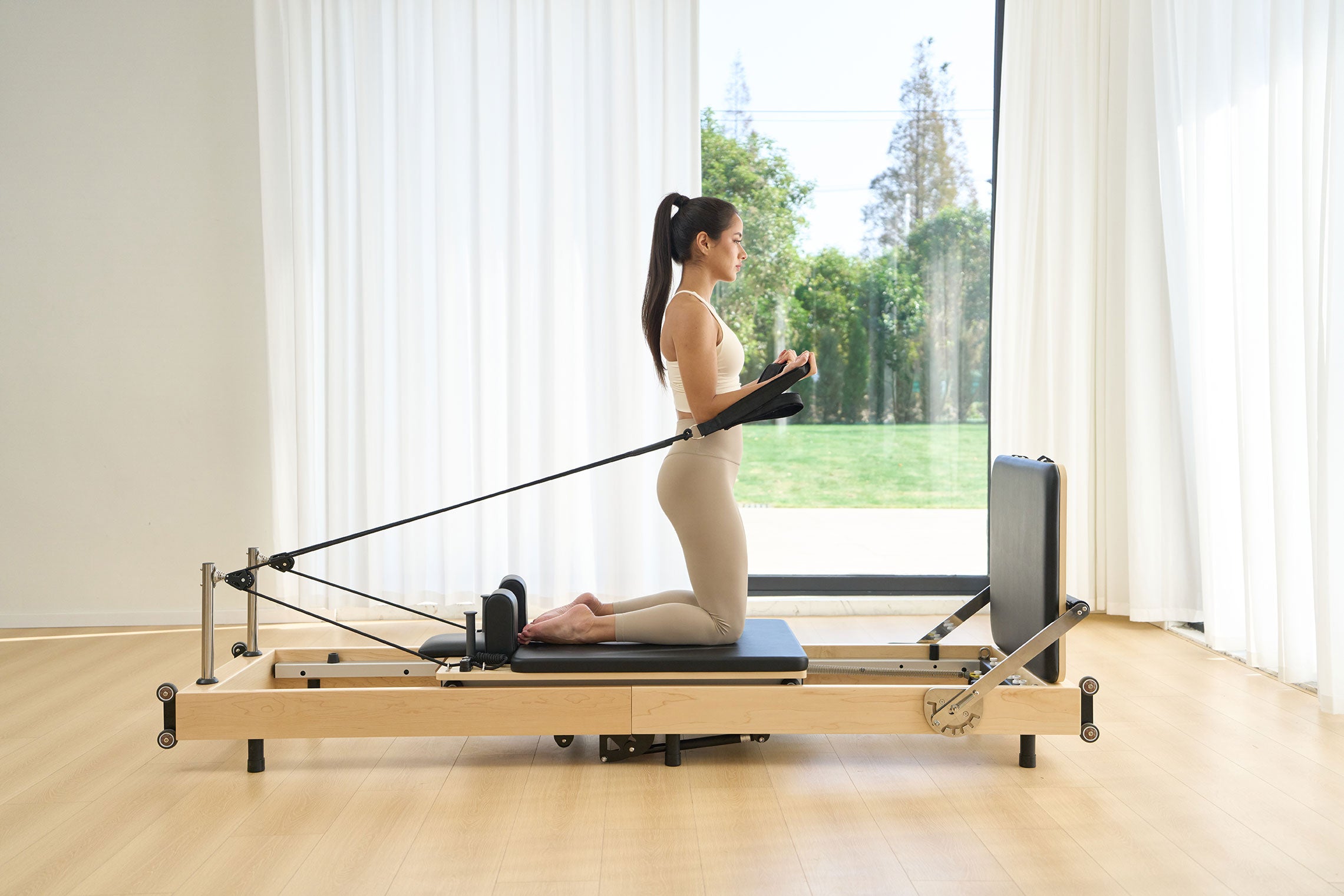 SpaceSaver™ Folding Maple Pilates Reformer