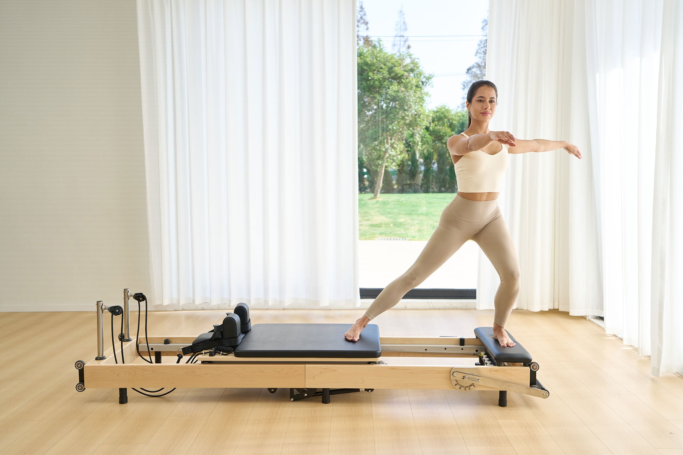 SpaceSaver™ Folding Maple Pilates Reformer
